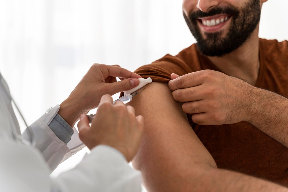 doctor-vaccinating-smiley-man_23-2148755573