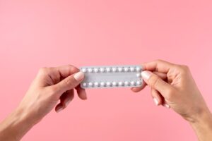 hands-holding-pill-foil-close-up
