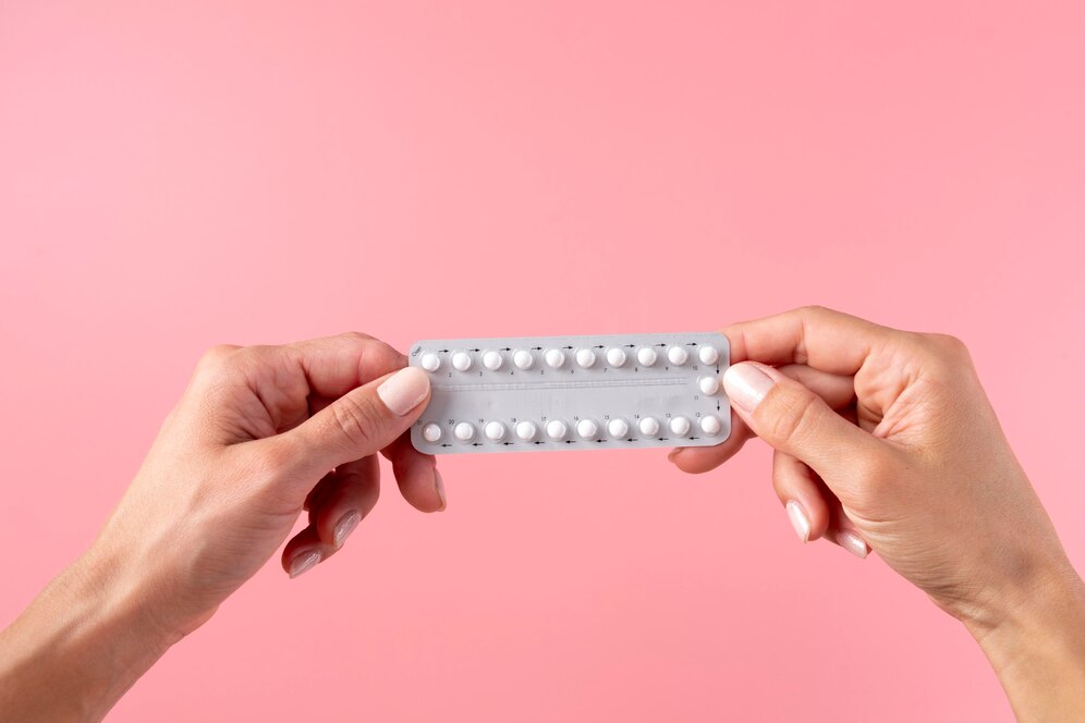 hands-holding-pill-foil-close-up